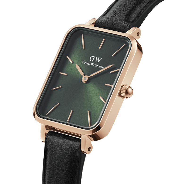 Quadro Pressed Sheffield Emerald Rose Gold watch featuring a rectangular rose gold case, emerald green dial, minimalist hour markers, and a black leather strap, shown in a close-up angled view highlighting its refined details.