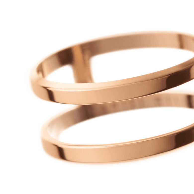 Close-up of the Elan Dual Ring Rose Gold showing its polished double-band design and warm rose gold finish, highlighting the minimalist style and smooth surface.