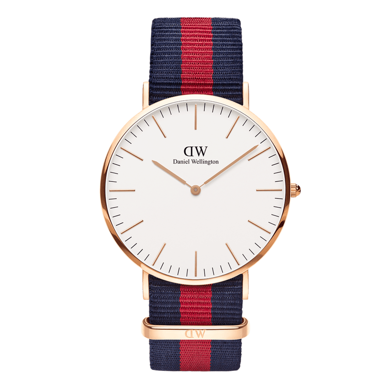 Classic Oxford Rose Gold watch featuring a slim rose gold case, minimalist white dial, and an adjustable blue and red striped NATO strap, suitable for both formal and casual wear.