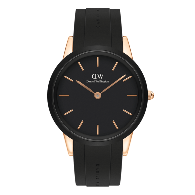 Daniel Wellington Iconic Motion Rose Gold watch with a black dial, rose gold markers and hands, and a black FKM rubber strap, featuring a minimalist design and a durable rose gold stainless steel case.