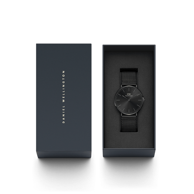 Classic Mesh Onyx Black watch presented in a sleek branded gift box, featuring a minimalist black dial and woven stainless steel mesh strap, ideal for gifting or everyday wear.