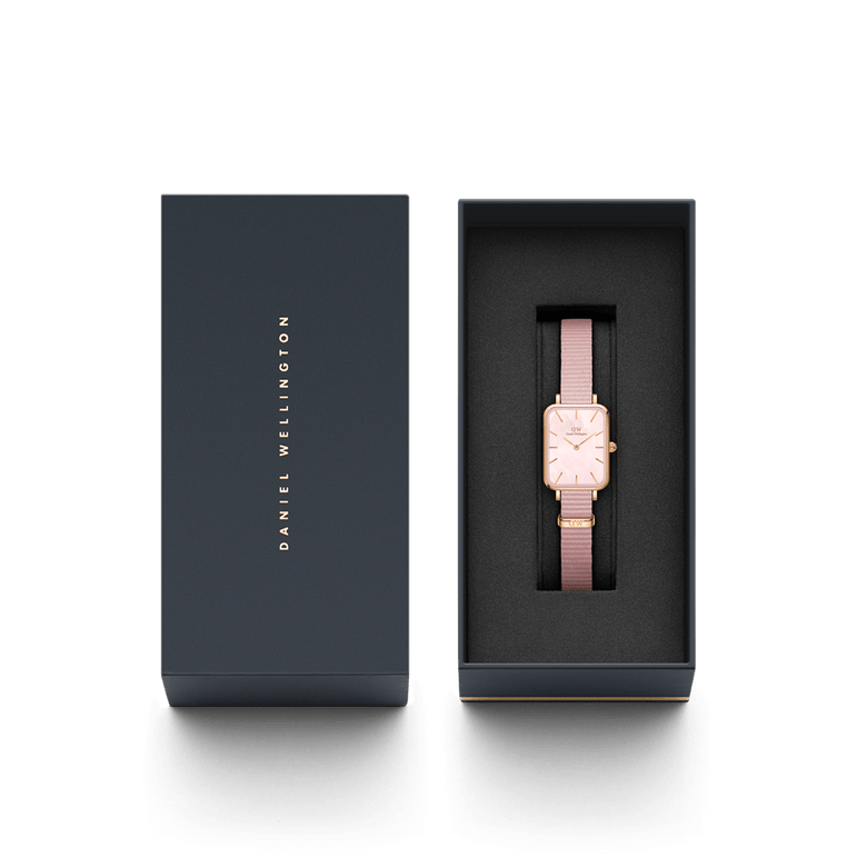 Quadro Coral Pink MoP Rose Gold watch with a pink mother of pearl dial and rose gold case, presented in a sleek Daniel Wellington gift box, highlighting its elegant design and suitability as a thoughtful gift for women.