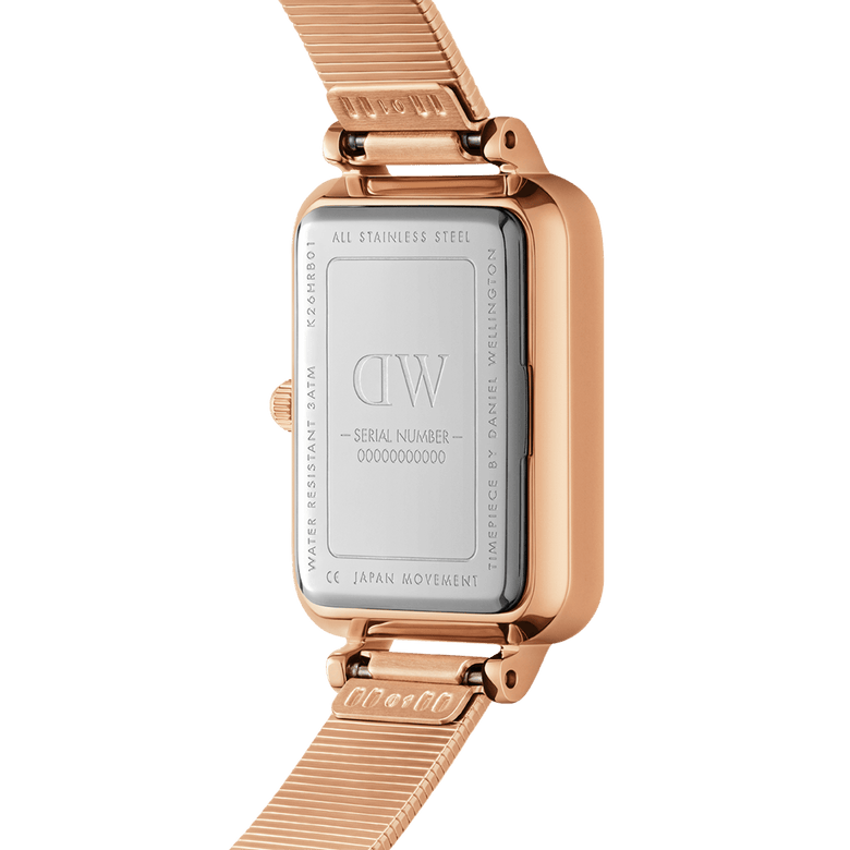 Close-up of the Quadro Lumine Pressed Piano Black MoP Rose Gold watch showing the stainless steel case back, rose gold finish, and piano link bracelet with adjustable clasp.