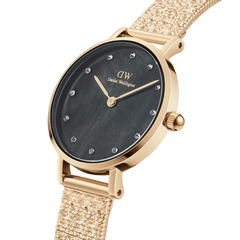 Petite Lumine Pressed Piano Black MoP Gold watch with a black mother of pearl dial, crystal hour markers, and a slim gold mesh-inspired pressed piano link strap.