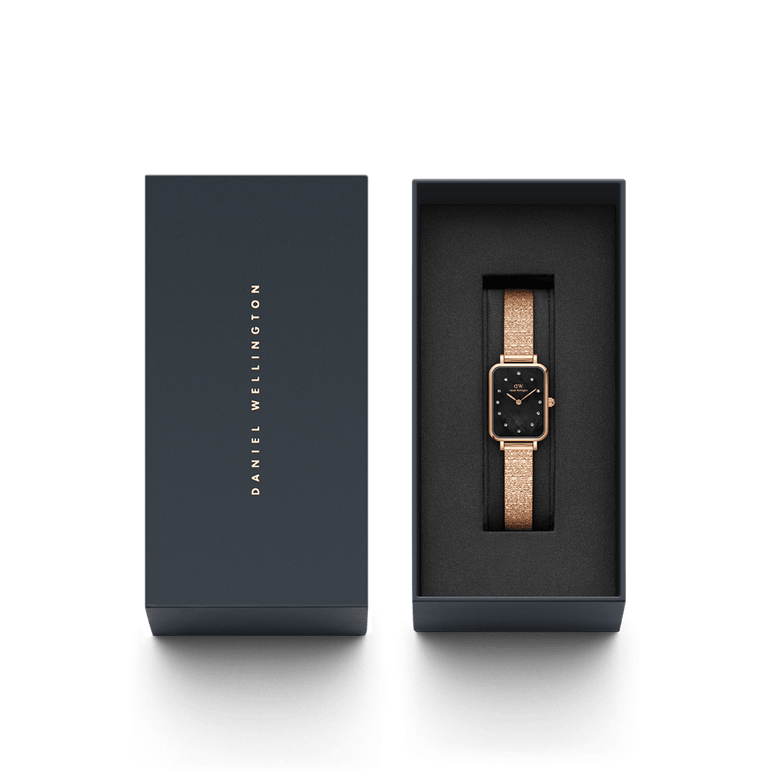 Quadro Lumine Pressed Piano Black MoP Rose Gold ladies watch presented in a sleek Daniel Wellington gift box, featuring a rose gold piano link bracelet and a black mother of pearl dial with crystal markers.