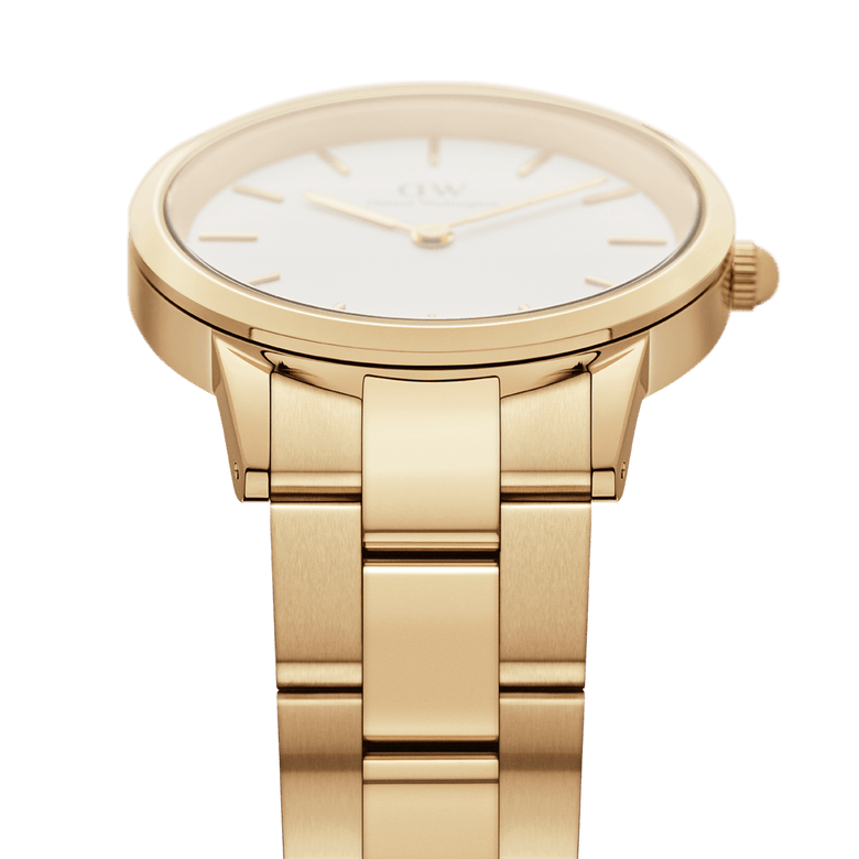 Detailed view of the Iconic Link Gold watch, highlighting the brushed gold stainless steel bracelet and the sleek, minimalist case with an eggshell white dial.