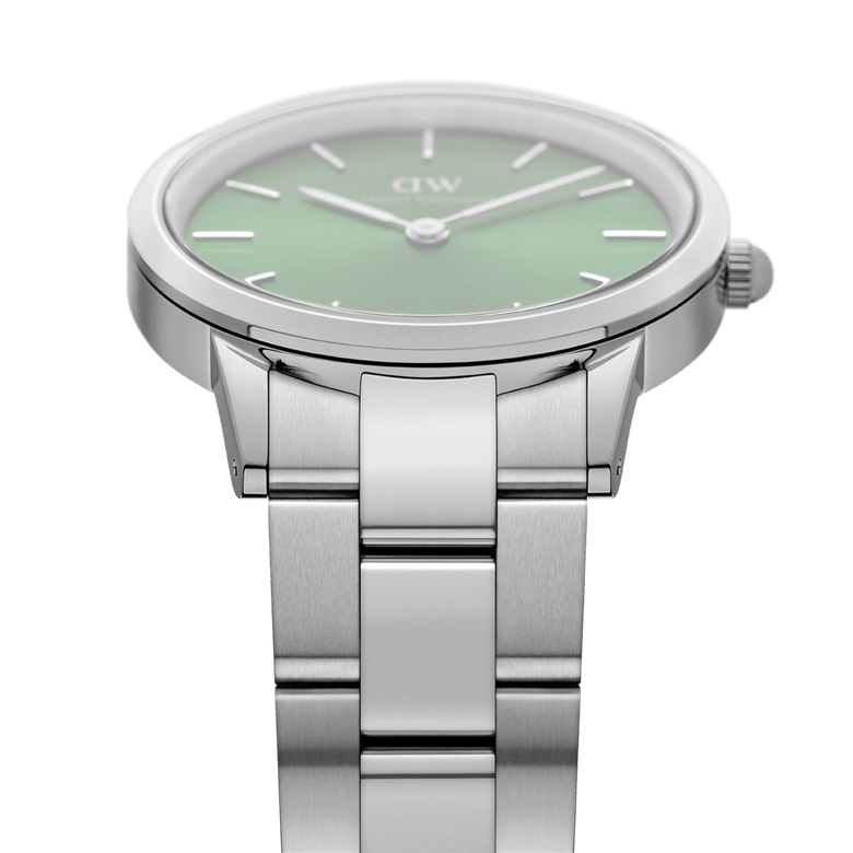 Side view of the Iconic Link Emerald Green Silver watch, showing the brushed stainless steel bracelet and the emerald green dial with minimalist markers.