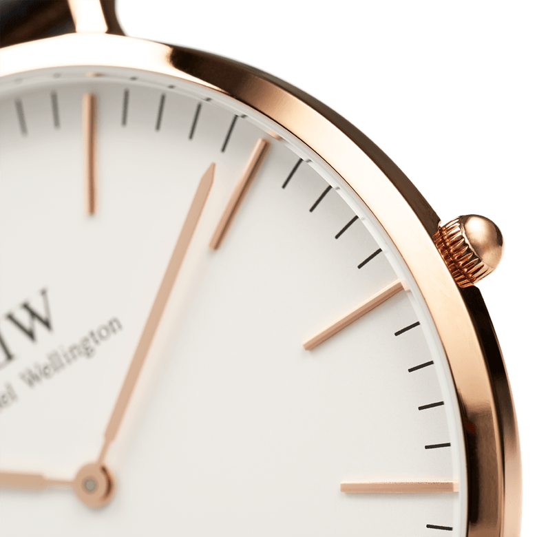 Detail view of the Classic Glasgow Rose Gold watch showing the polished rose gold case, minimalist white dial, and slim rose gold hour markers and hands.