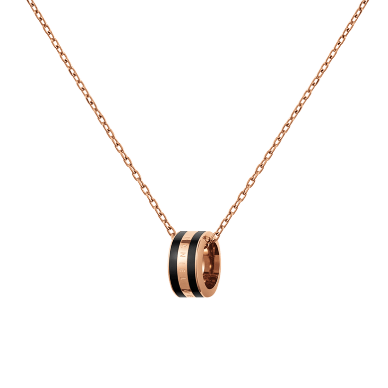 Rose gold chain necklace featuring a circular black enamel pendant with engraved detailing, showcasing a minimalist and modern design suitable for everyday wear or layering with other jewellery.