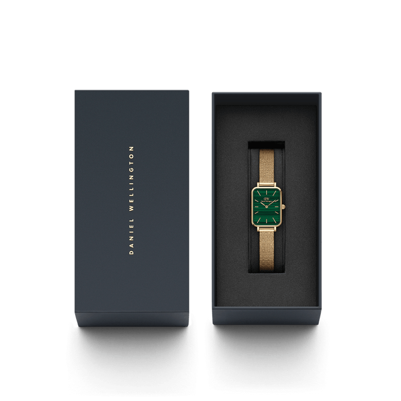 Quadro Pressed Evergold Green Gold watch for women presented in a sleek Daniel Wellington gift box, featuring a rectangular gold case, green dial, and gold mesh bracelet.