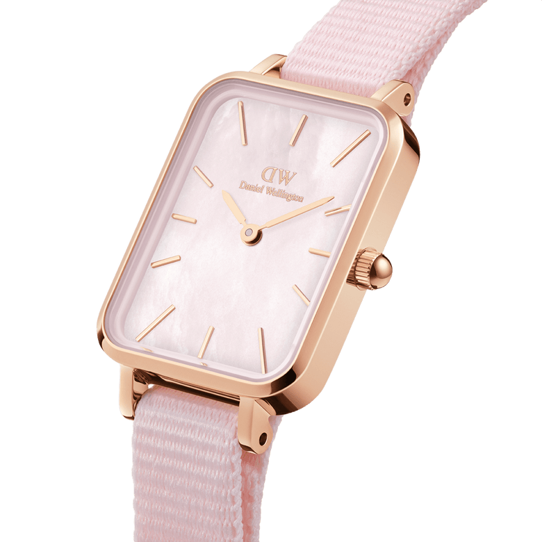 Quadro Coral Pink MoP Rose Gold features a rectangular rose gold case, pink mother of pearl dial, minimalist hour markers, and a soft pink NATO strap, highlighting its refined and feminine design for everyday wear.