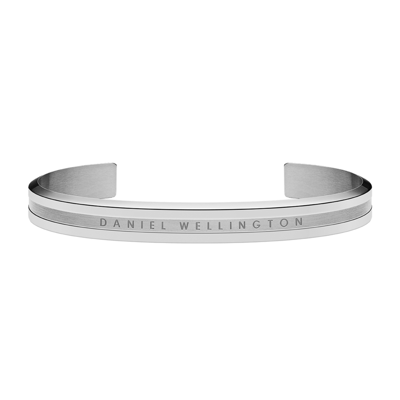 Elan Bracelet Silver features a slim, open cuff design in polished stainless steel with the Daniel Wellington logo engraved across the front, offering a versatile and modern jewellery option for men and women.