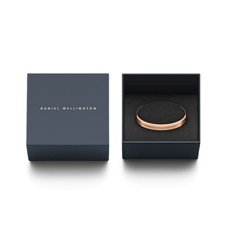Elan Bracelet Rose Gold by Daniel Wellington presented in a navy gift box, highlighting its polished rose gold finish and engraved logo, ideal for gifting or adding to a jewellery collection.