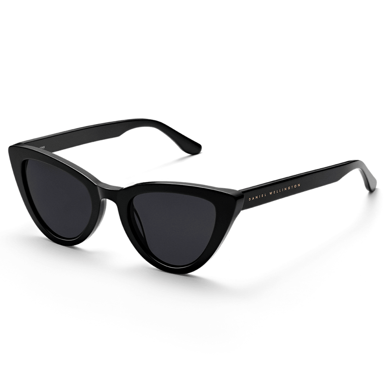 Lynx Bio-Acetate Black sunglasses featuring a bold cat eye shape, glossy black bio-acetate frame, dark nylon lenses, and subtle Daniel Wellington branding on the temples.