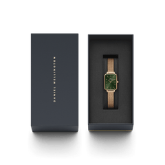 Quadro Pressed Melrose Emerald ladies watch with a rectangular emerald green dial and rose gold mesh strap, elegantly presented in a branded Daniel Wellington gift box.