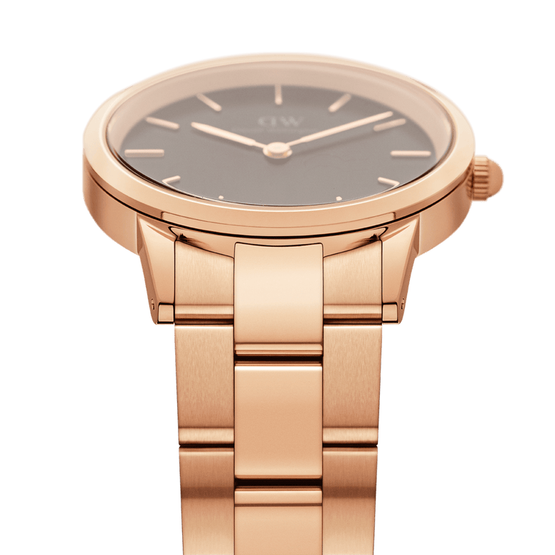 Detail view of the Daniel Wellington Iconic Link Black Rose Gold watch, highlighting the brushed rose gold stainless steel bracelet and minimalist black dial.