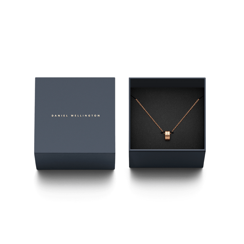 Elan Necklace Rose Gold displayed in an elegant Daniel Wellington gift box, featuring a minimalist rose gold ring pendant on a fine chain, ideal for gifting or adding a refined touch to your jewellery collection.