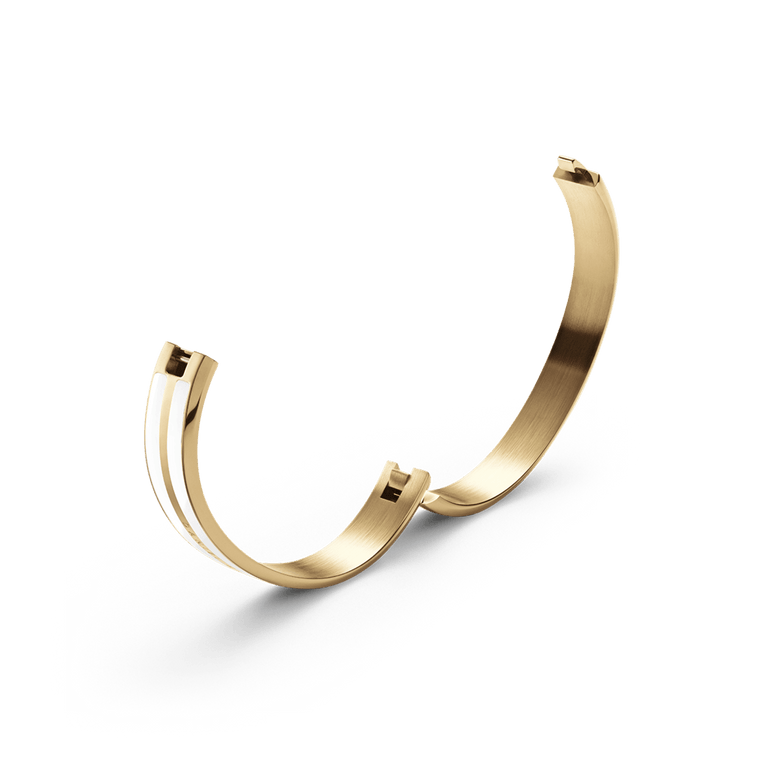 Minimalist Emalie Infinite Gold Satin White bracelet in polished gold-tone stainless steel, featuring a smooth satin white enamel accent and an open bangle design with integrated clasp.