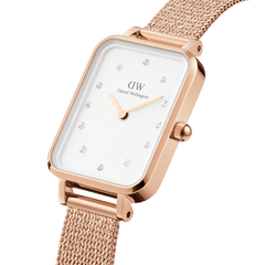 Quadro Lumine Pressed Melrose rose gold ladies watch with a rectangular case, eggshell white dial, crystal hour markers, and a slim rose gold mesh strap, shown in a close-up angle highlighting its elegant design.