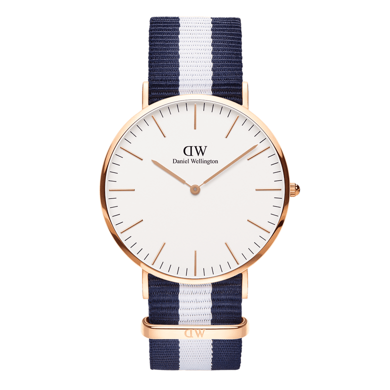 Classic Glasgow Rose Gold watch with a round rose gold case, minimalist white dial, and a blue and white striped polyester NATO strap, blending timeless elegance with a nautical-inspired design.