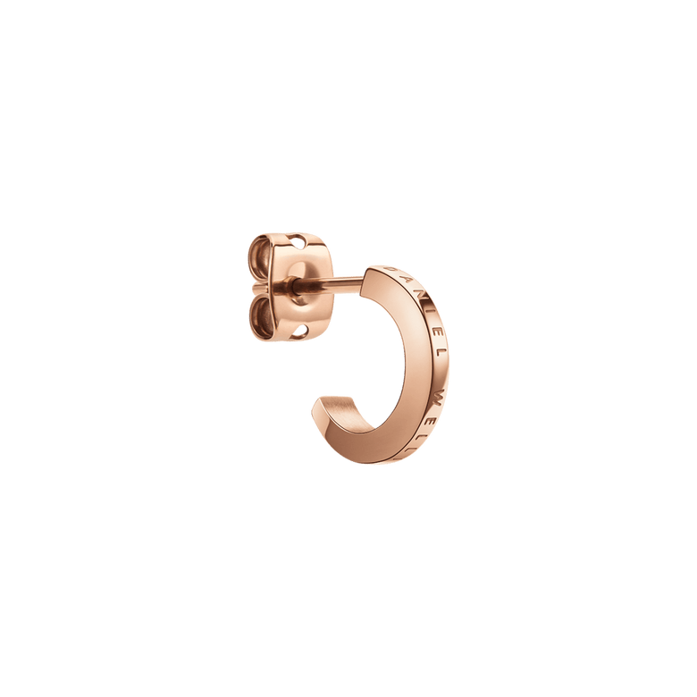 Daniel Wellington Elan Earrings Rose Gold shown in close-up, highlighting the minimalist huggie shape, engraved logo detail, and polished rose gold finish.