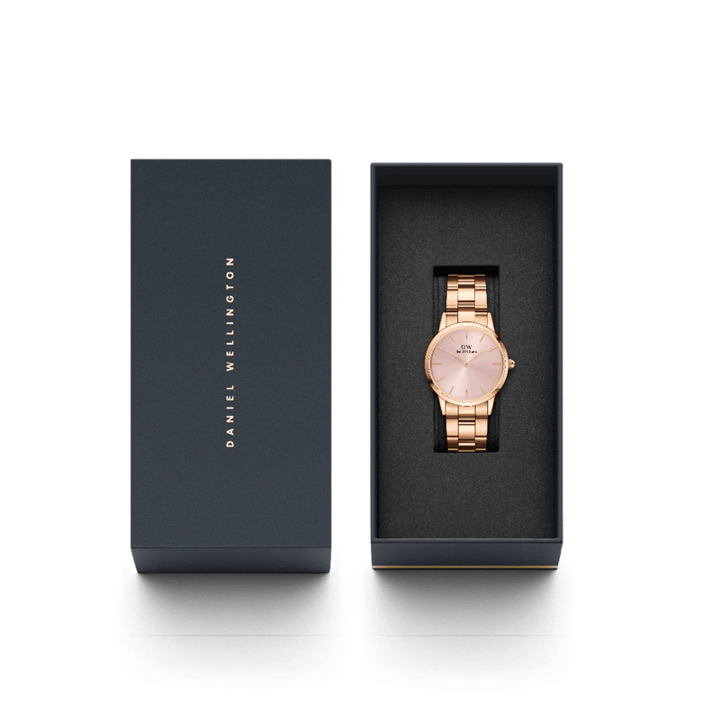 Iconic Link Pink Rose Gold ladies watch with a soft pink sunray dial and rose gold link bracelet, elegantly presented in a branded Daniel Wellington gift box.
