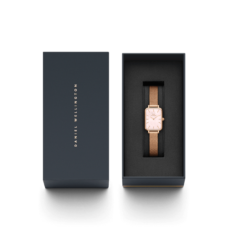 Quadro Pressed Melrose Pink MoP Rose Gold ladies watch with a rectangular rose gold case and mesh strap, elegantly presented in a branded Daniel Wellington gift box.