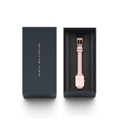 Quadro Cherry Blossom ladies watch with a pastel pink leather strap and rose gold rectangular case, presented in a branded Daniel Wellington gift box.