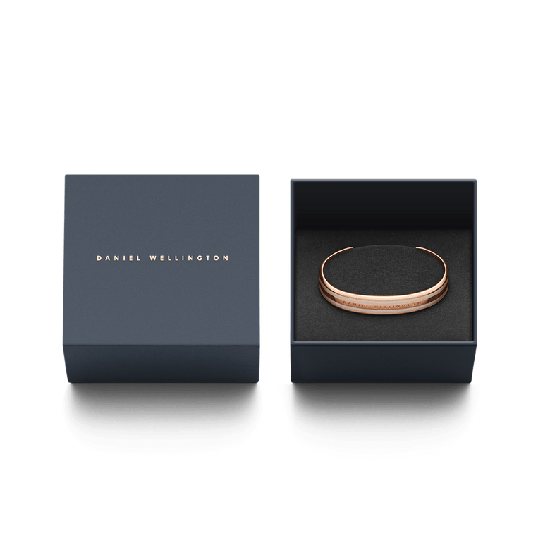 Emalie Bracelet Desert Sand Rose Gold presented in a navy Daniel Wellington gift box, highlighting the rose gold cuff and desert sand enamel detail as a stylish jewellery gift option.