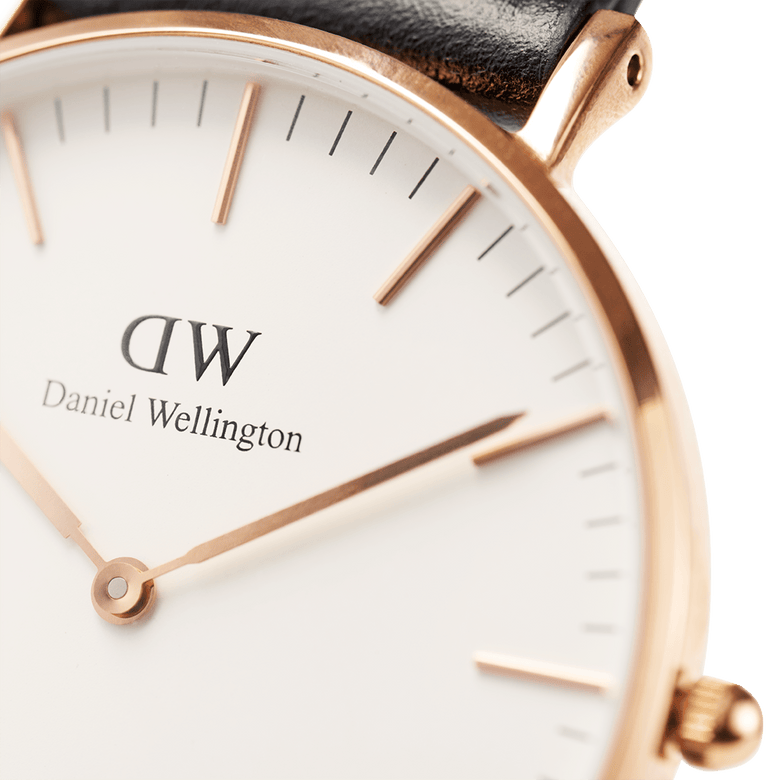 Detail of the Classic Southampton watch featuring a rose gold case, minimalist white dial with rose gold hands and markers, and a black leather strap.