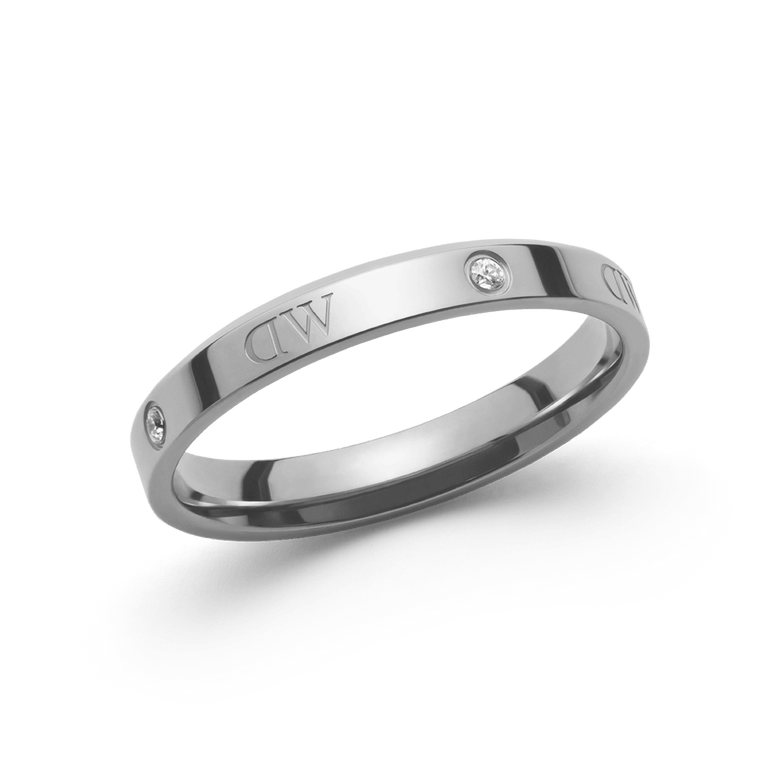 Slim silver Classic Lumine Ring featuring a polished stainless steel band, sparkling crystal accents, and engraved logotype details, shown against a plain background.