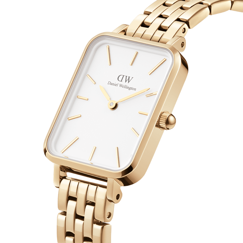 Quadro 5-Link Evergold watch featuring a rectangular gold case, minimalist white dial, and a polished 5-link gold bracelet, shown in a close-up angle highlighting its refined details.