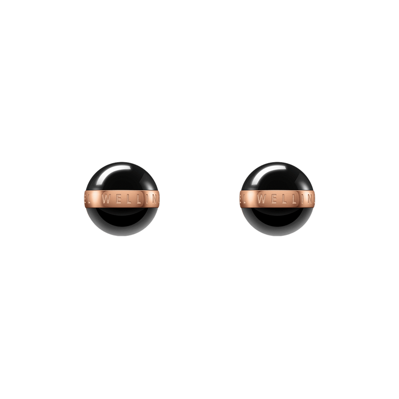 Aspiration Earrings Rose Gold Black feature polished black ceramic spheres with a rose gold plated band engraved with branding, showcasing a minimalist stud design ideal for everyday wear.