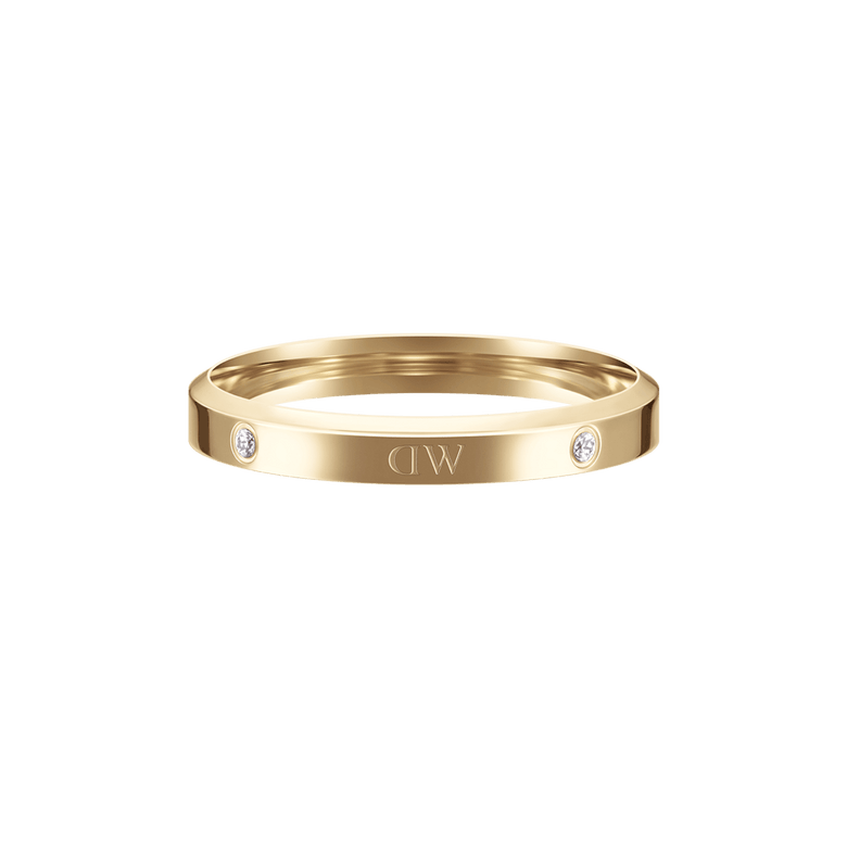 Classic Lumine Ring Gold featuring a slim, polished gold band with sparkling crystal accents and engraved logo detail, designed for stacking or wearing solo.