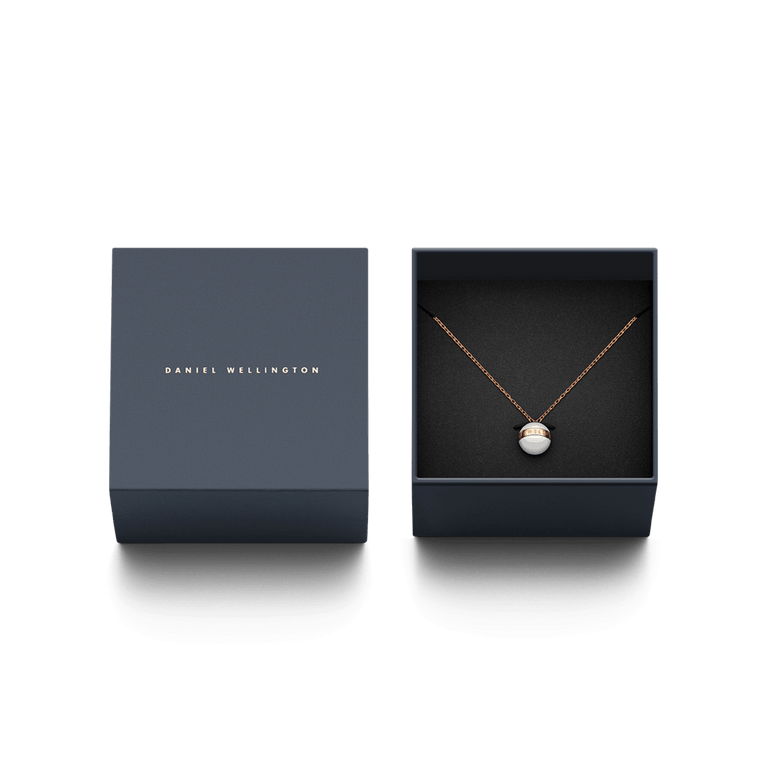 Aspiration Necklace Rose Gold Satin White presented in a Daniel Wellington gift box, featuring a rose gold chain and satin white ceramic pendant with a rose gold plated band, ideal for gifting or special occasions.