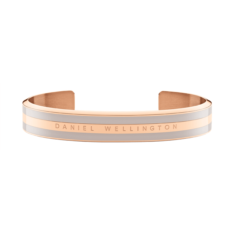 Emalie Bracelet Desert Sand Rose Gold displays a wide, double-plated stainless steel cuff with rose gold and desert sand enamel, finished with Daniel Wellington branding for a sophisticated, modern look.