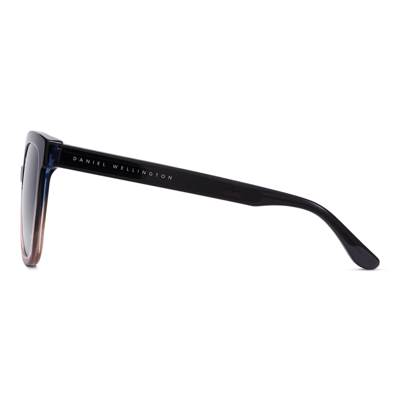 Side view of the Grande Bio-Acetate Blue Coral Blue sunglasses by Daniel Wellington, showing the sleek dark blue acetate arm with branded detailing and the gradient frame.