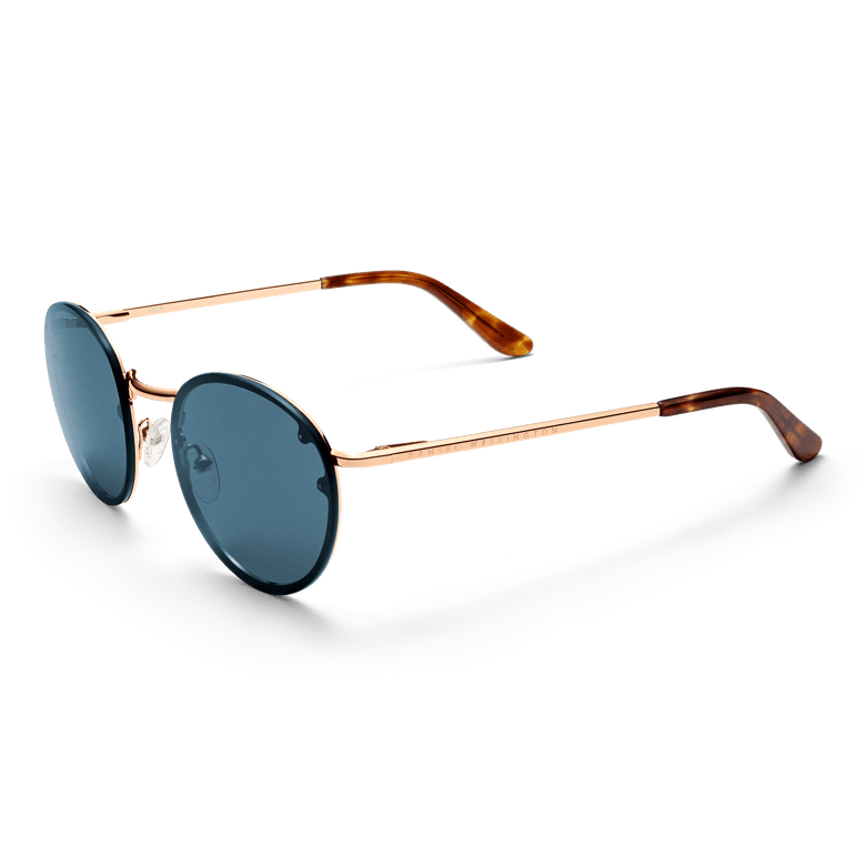 Arch Steel Blue Rose Gold sunglasses with round blue UV400 nylon lenses, rose gold plated stainless steel frame, adjustable silicone nose pads, and tortoiseshell acetate temple tips, presented in a three-quarter view.
