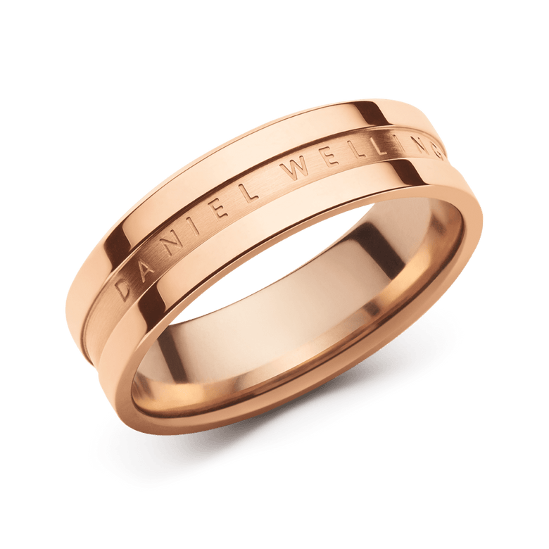 Rose gold ring with a slim, minimalist band and engraved Daniel Wellington branding, featuring a polished finish and modern profile.