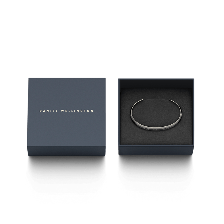 Classic Bracelet Graphite by Daniel Wellington presented in elegant packaging, featuring a slim graphite cuff with engraved branding, ideal as a stylish gift for everyday wear.