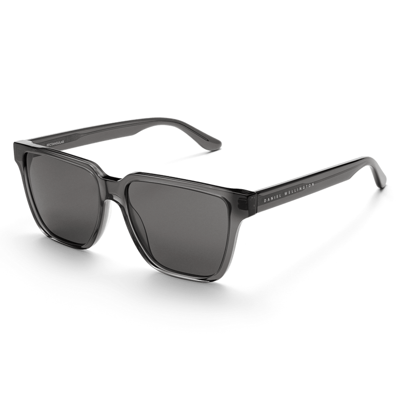 Rectangular Bio-Acetate Grey Grey sunglasses featuring a transparent grey oversized frame, matching grey UV400 lenses, and Daniel Wellington branding on the temple for a stylish and durable look.