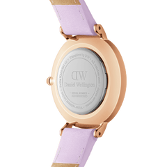 Back view of the Petite Lavender Rose Gold ladies watch showing the engraved stainless steel case and pastel lavender leather strap, highlighting its quality craftsmanship and adjustable design.
