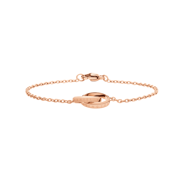 Rose gold Elan Unity Bracelet with two engraved interlocking rings and a fine chain, showcasing a modern minimalist design suitable for both casual and formal wear.