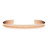 Rose gold Elan Bracelet with a sleek open cuff design, engraved Daniel Wellington logo, and polished finish, ideal for layering or everyday wear.