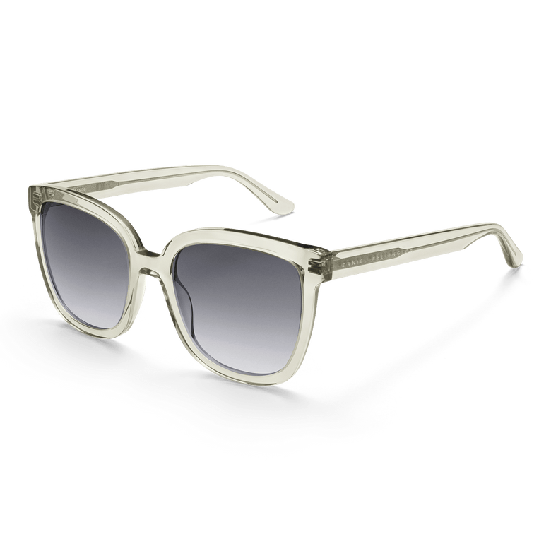 Grande Bio-Acetate Olive Olive sunglasses featuring a clear olive oversized square frame and black gradient UV400 lenses, shown at an angle to highlight the sleek, modern design and sustainable bio-acetate material.